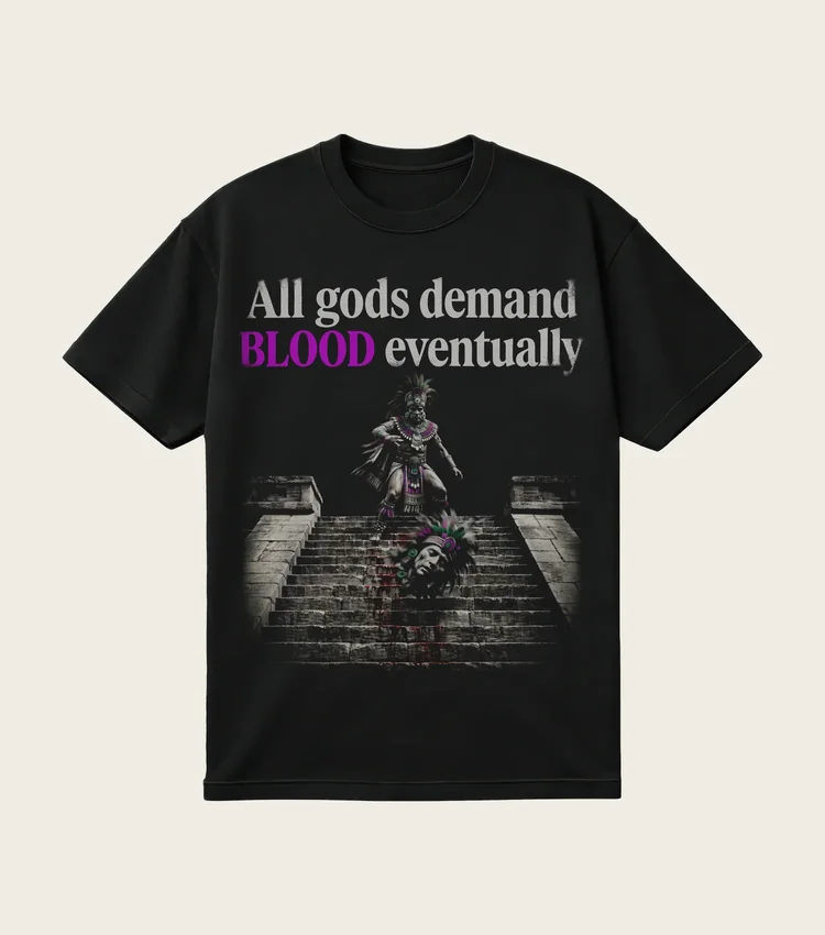 All Gods Demand Blood Eventually printed on a black t-shirt, laid flat