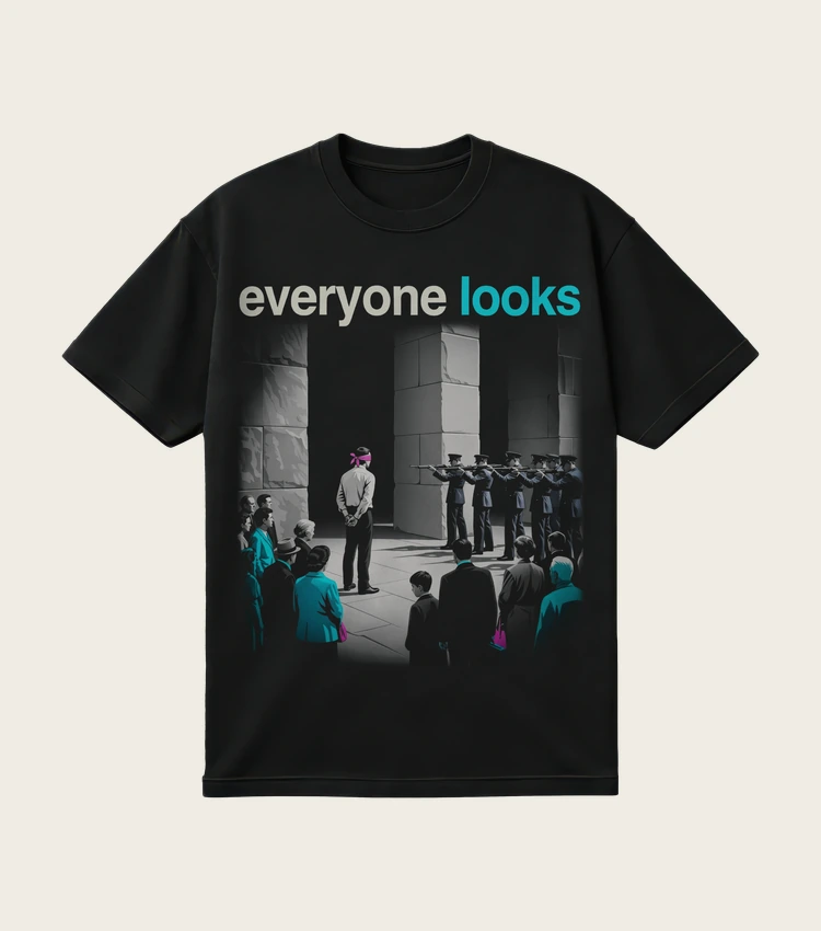 Everyone Looks printed on a black t-shirt, laid flat