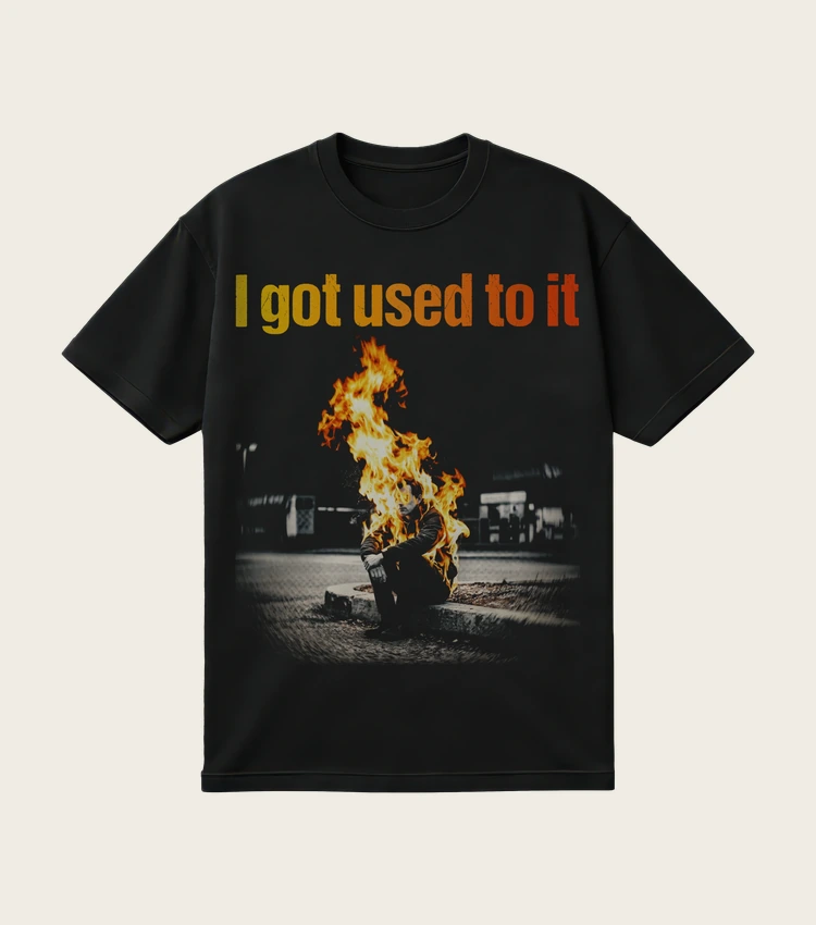 I Got Used to It printed on a black t-shirt, laid flat