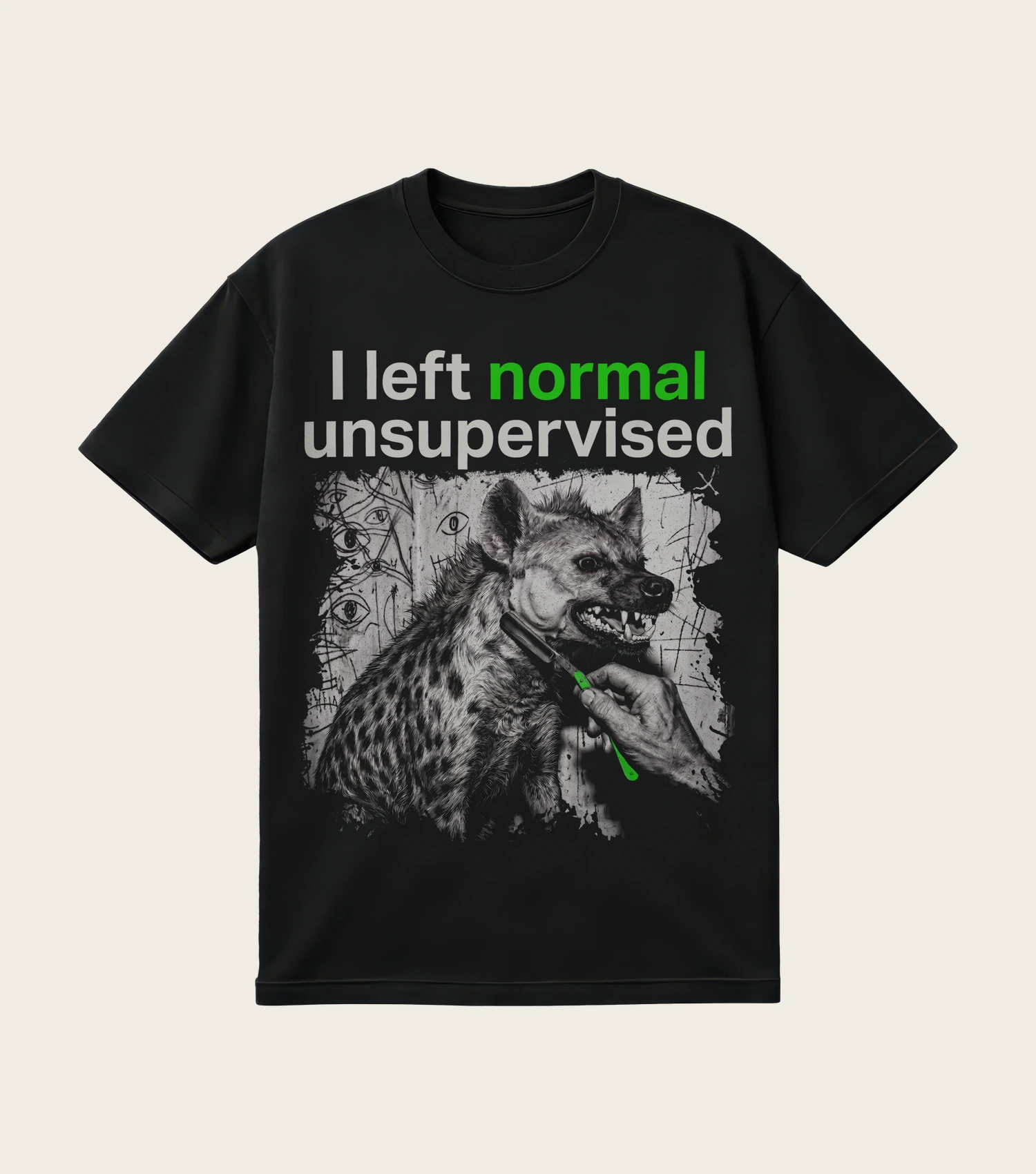 I Left Normal Unsupervised printed on a black t-shirt, laid flat