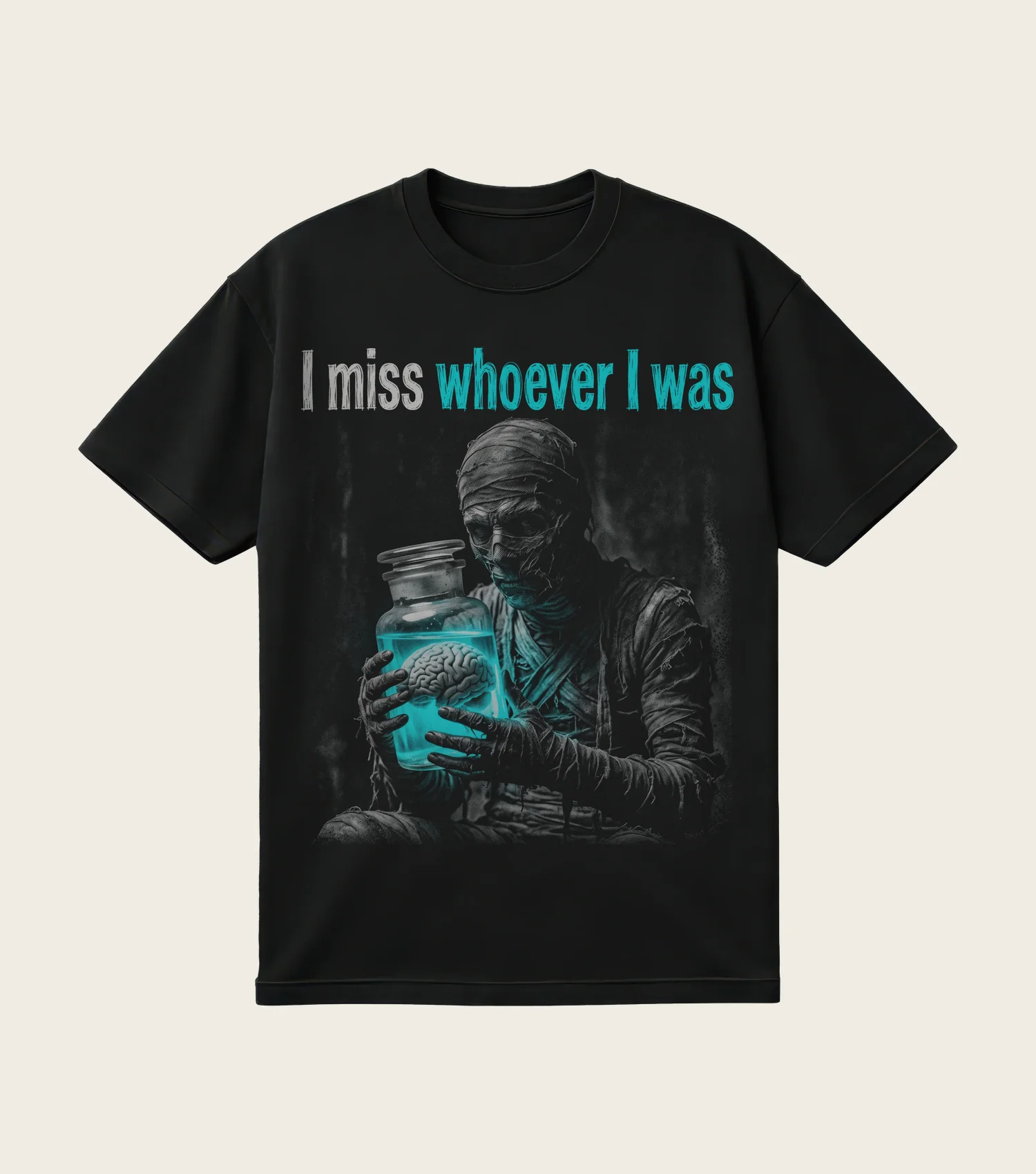 I Miss Whoever I Was printed on a black t-shirt, laid flat