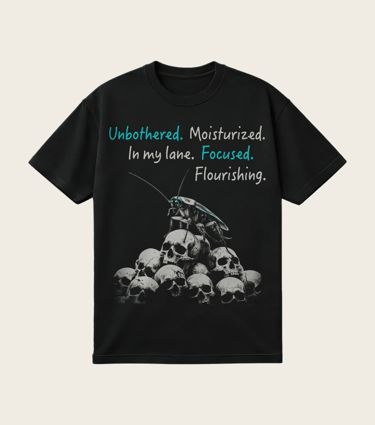 Focused. Flourishing. printed on a black t-shirt, laid flat